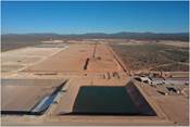 Figure 2: Pregnant Solution Pond (front), Heap Leach Pad (back), Merrill-Crowe Plant (right) (CNW Group|Orla Mining Ltd.)